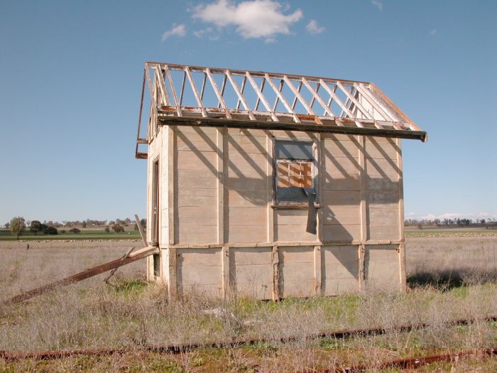 
The ruins of the signal box at the up end of the station.  The ramp on the
left once led from the platform.  The inside is gutted.
