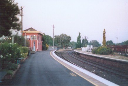 The view looking along the up platform towards the signal box.