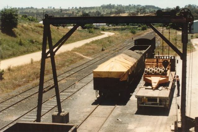 
The goods crane is in action, with some farming equipment being offloaded onto
a truck.
