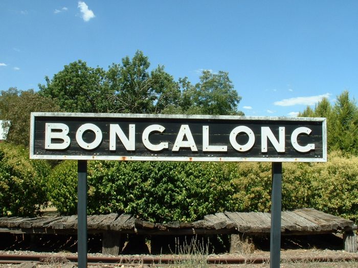 
The station nameboard stands in front of the remains of the wooden platform.
