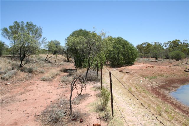 The dam which served as the reservoir for a water tank. The line is visible on the far left distance.