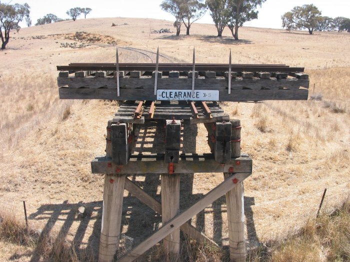 A section has been cut out of the bridge, and then placed on the line as a barrier.