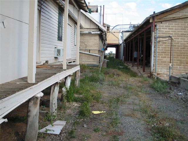 
The weeds now grow in irregular formation from where the line has been
lifted. A small platform on this office building also serviced the train
as it passed through the abbatoir.
