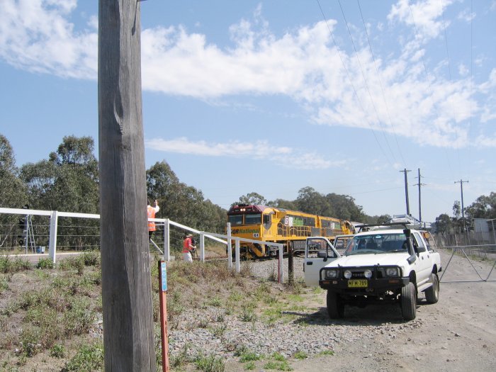 A QR grain train being filmed as it passes through the station towards Newcastle.