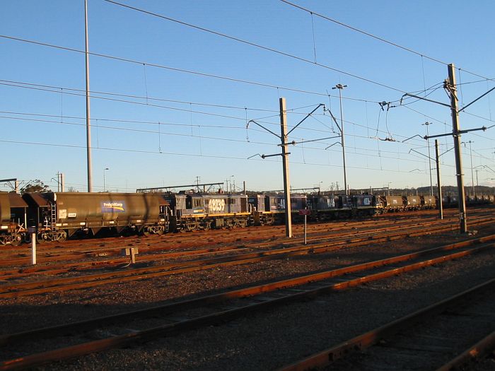 
Wagons and 48 clss locos sit idle in the yard.
