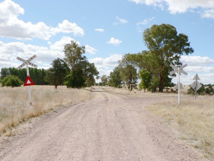 The view looking south towards the level crossing adjacent to the station location.