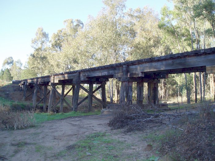 A closer view of the bridge over a creek.