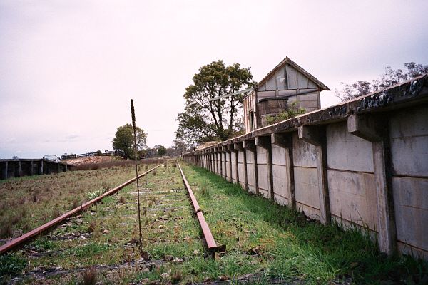 
A rail-level view looking up the line along the platform face.
