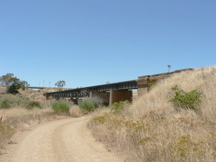 The western side of the nearby bridge over the road.