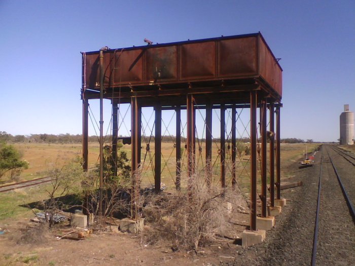 The view of the elevated water tank looking west. The eastern leg of the triangle curves away on the left. The former loco servicing facilities (coal bunker, ash bit and engine shed) were located directly behind the tank.