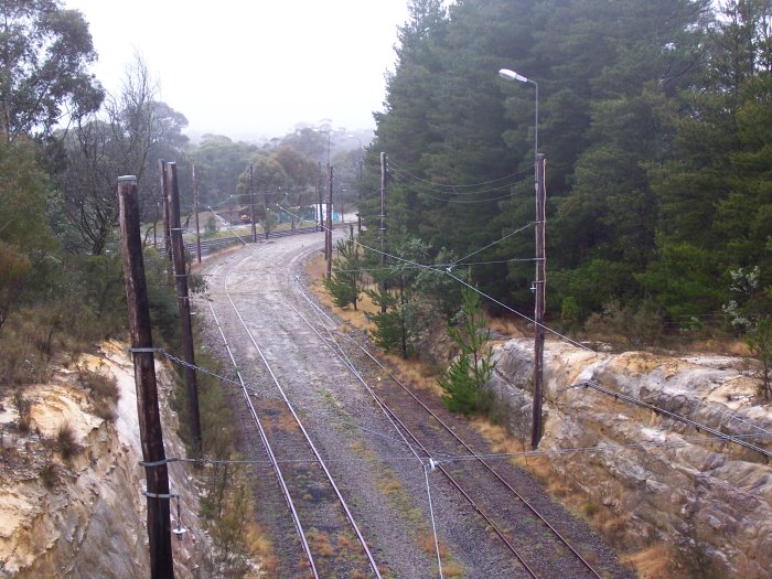 The view looking north from the junction. The branch line nears the main line in the distance before curving away to the right.