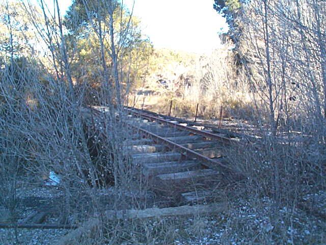 The turntable is surrounded by weeds, but still present.
