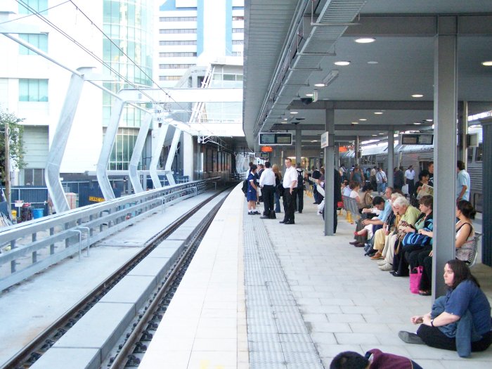 A view north along Platform 2, showing the distinctive and elegant supports for the traction wires.