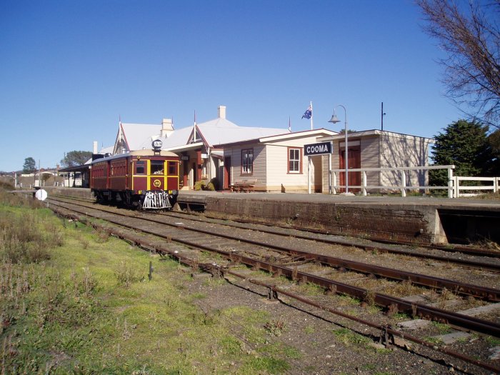 The view looking south across to the station with preserved railcar CPH 22 at the platform.