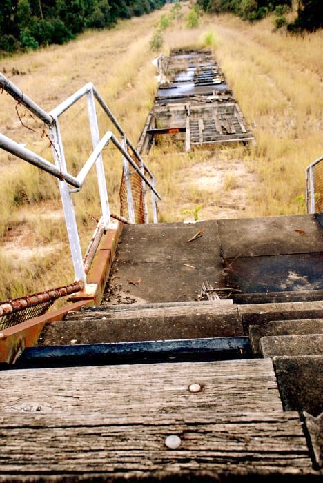 The view looking down the dilapidated stairs to the remains of the platform.