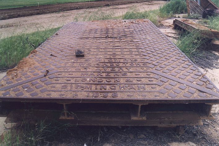 
The remains of the goods scales lie in the yard.
