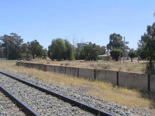 A small damaged sign sits atop the platform.