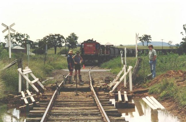 Repair work being performed on a culvert adjacent to the level crossing. This is the view looking towards Sandy Hollow.