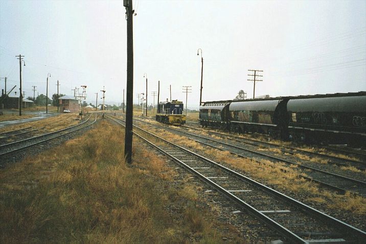 
A 48 class loco sits in the yard on a wet and overcast day.  In the background
is Harden South signal box.
