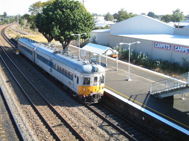 
Diesel railcars 631+??? sit at High Street in this view from the
footbridge looking towards Maitland.
