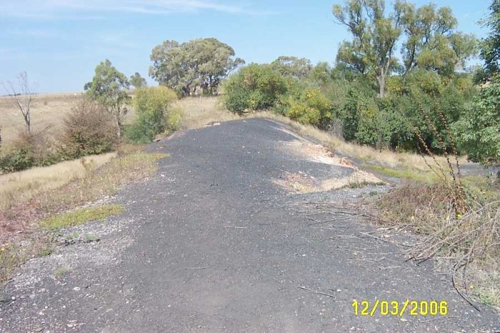 The high embankment looking back towards the main line. Just to the left of the embankment middle of photo can be seen the top of the concrete arch over the creek.