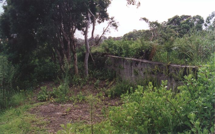 
The concrete platform face is all that remains at station.
