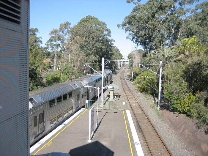 A suburban set pulls out of Killara platform 1 heading for the city.