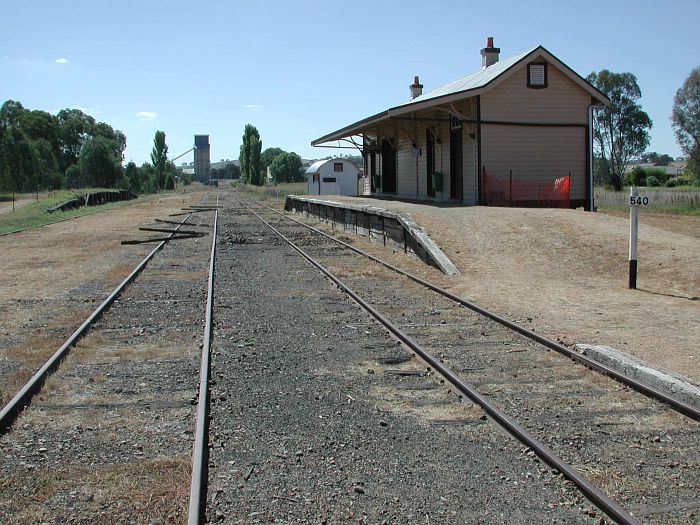 
The view looking down the line towards Wagga Wagga.
The view from the pedestrian crossing near the A Frame, facing north. The
Home Signal is just visible in the distance, past the poplar.
