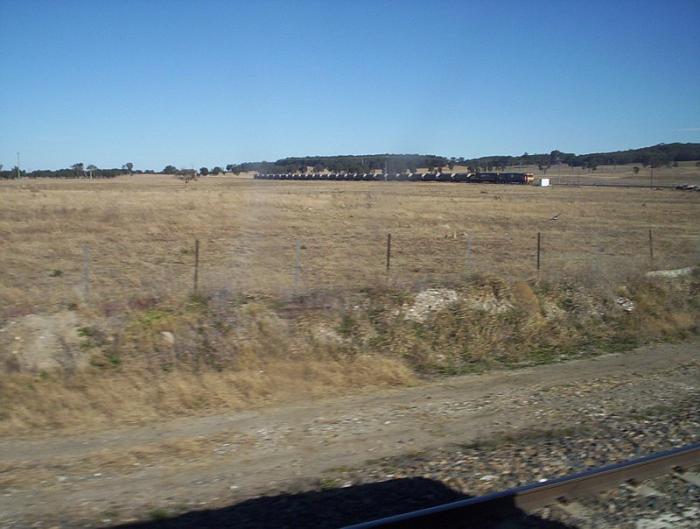 
Two NR class locomotives on 2928 limestone (Medway Quarry - Port Kembla Inner
Harbour) wait on the branch for a path at Medway Junction.
