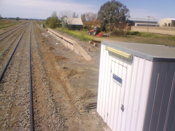 The view looking up the line towards the station. The loop line that served the platform has long been lifted.