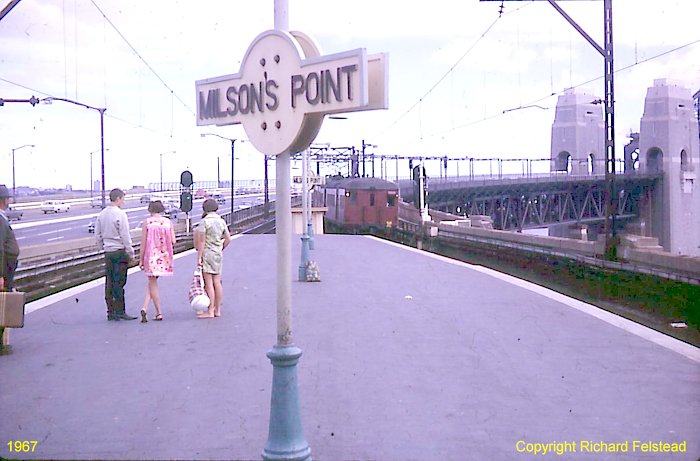 The view looking south from the station towards the bridge, as a north-bound "red rattler" service approaches the station.