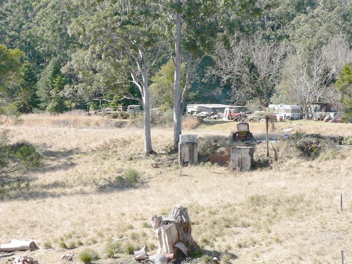 The view looking north. The station was located out of frame on the right. The concrete bases are likely the remains of a large derrick crane.