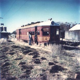 
Railmotor 403 passenger service Moree to Inverell, crossing the
Weed Killer Train (Poison Train), which is in the goods siding behind.
