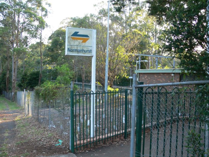 A station name board at the entrance to the down platform.