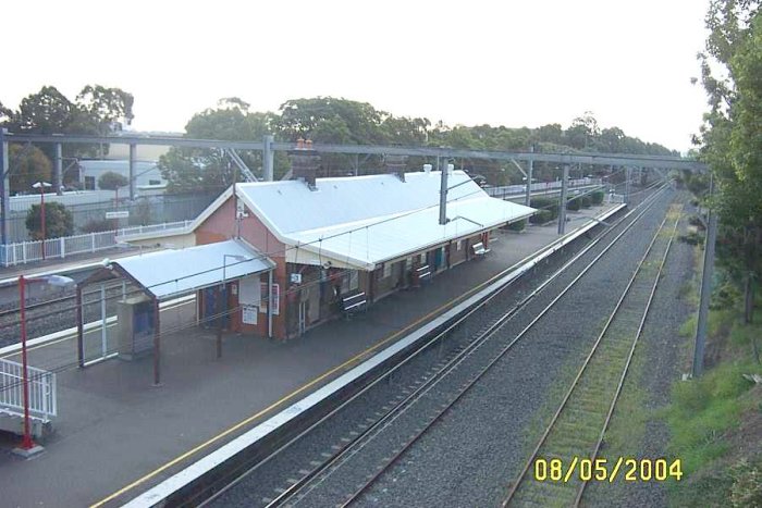 The view looking down onto platform 1 in a northerly direction.  The track on the right is the Up Relief line.