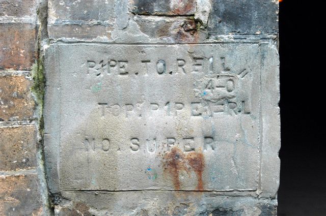 A track information plaque at the up portal.