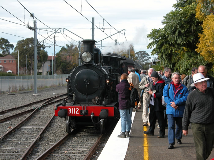 3112 stands on the back platform.