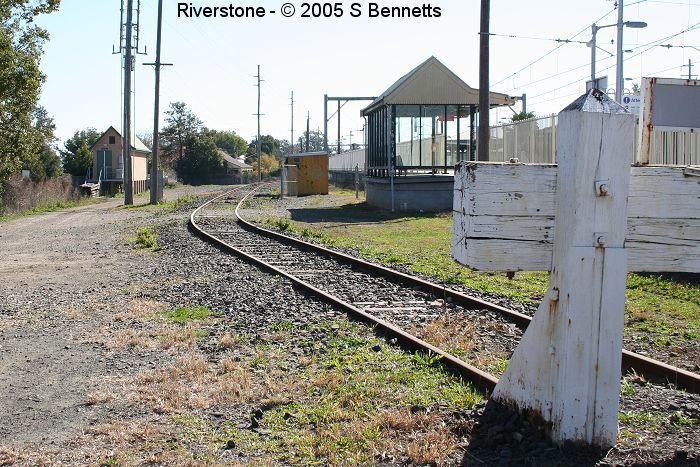 A view taken from near the station entrance beside level crossing. This siding was once the Goods Siding which was connected to the branch line behind where this picture was taken. The level crossing once had 3 tracks.