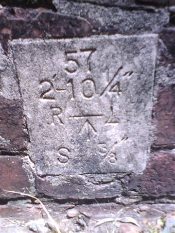 A survey marker embedded in the platform face.