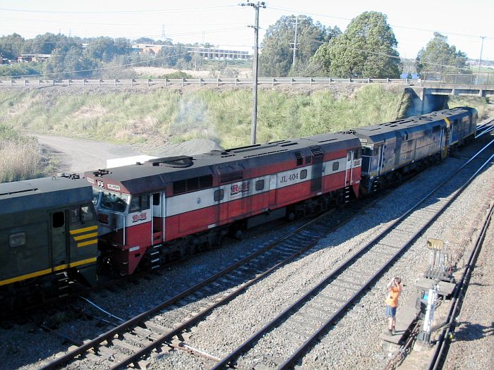 
A train headed by JL401/JL403/JL404/??? in different liveries, works Toll's
Siding.
