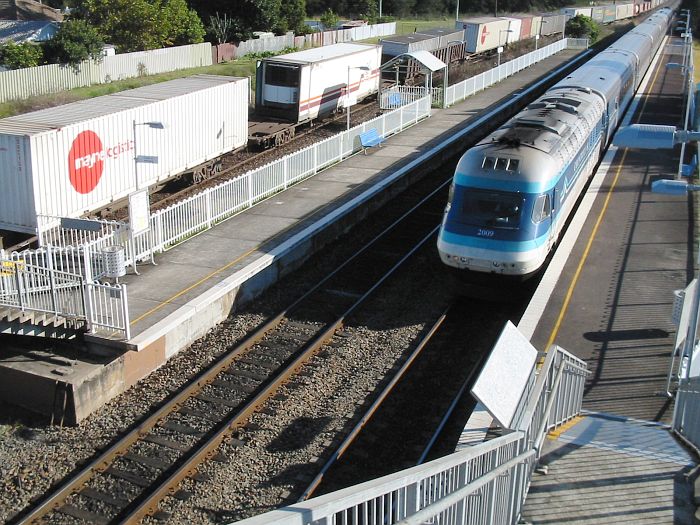 
A southbound XPT and freight trains pass through Sandgate.
