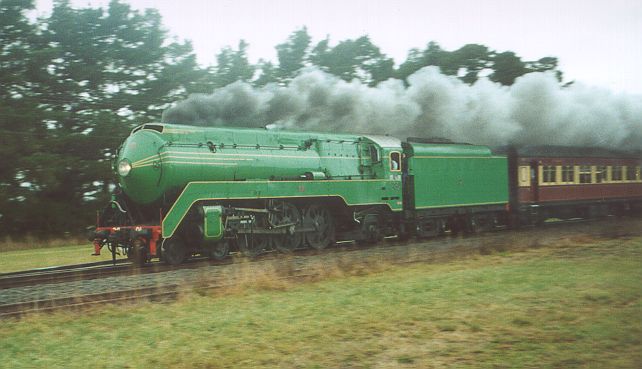 
3801 on a tour train passing through Spring Hill.
