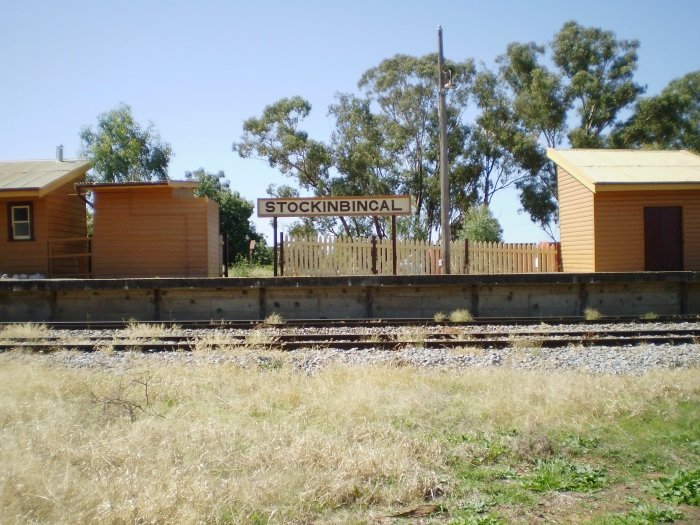 The view looking across to the station sign on the platform.