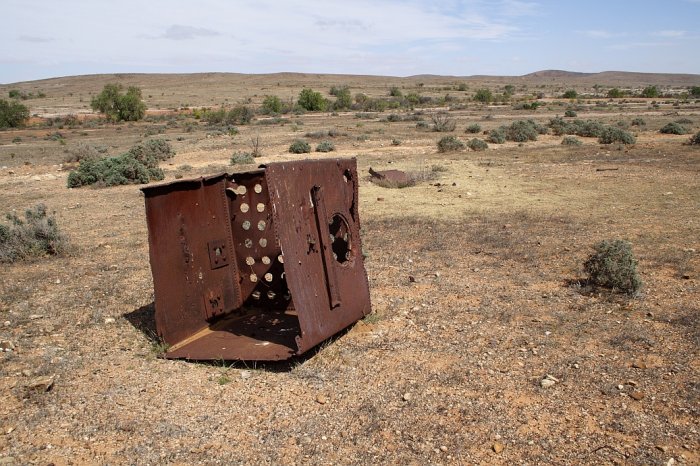 The remains of a water tank in the yard.