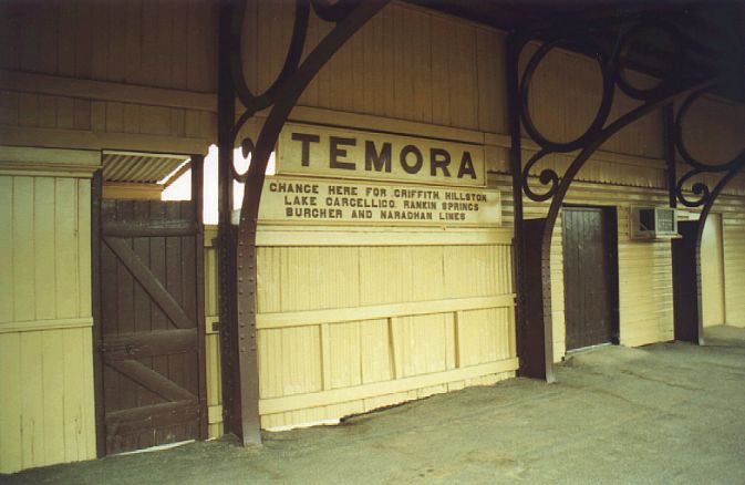 
The sign reads, "Change here for Griffith, Hillston, Lake Cargelligo,
Rankins Springs, Burcher and Naradhan Lines".  Only Griffith is currently
served by passenger trains.
