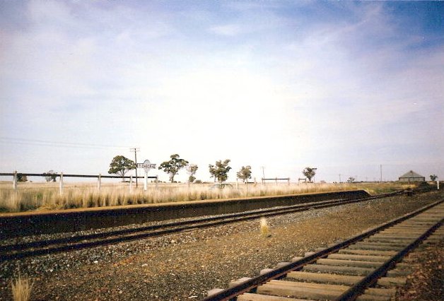 The overgrown platform still has a signboard.