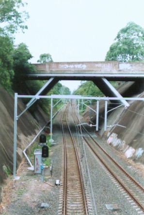 The view looking south towards Pymble from the footbridge over the station. The bridge in the foreground is the Pacific Highway overpass.