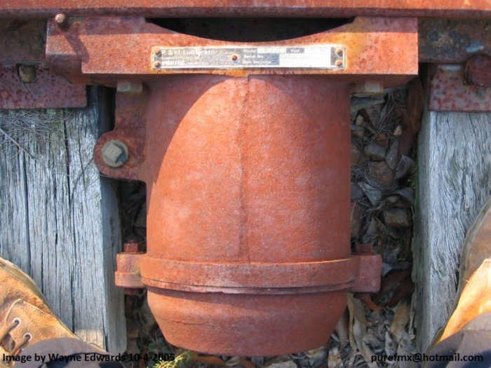 A flange lubricator, probably near a tight curve.