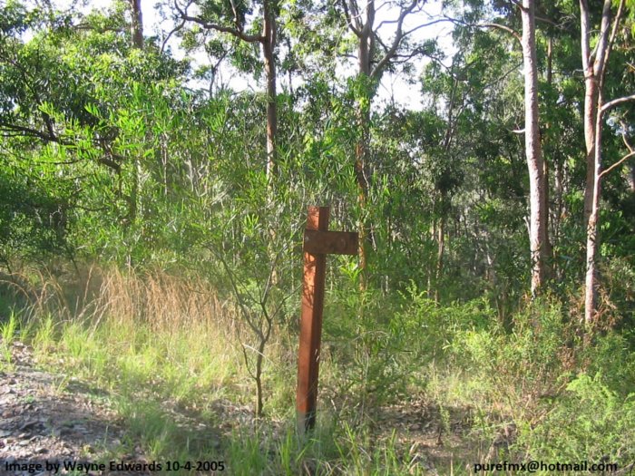 A kilometre post alongside the line.