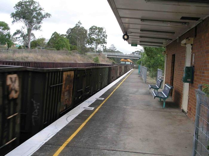 
A southbound empty freight train passing through the station.
